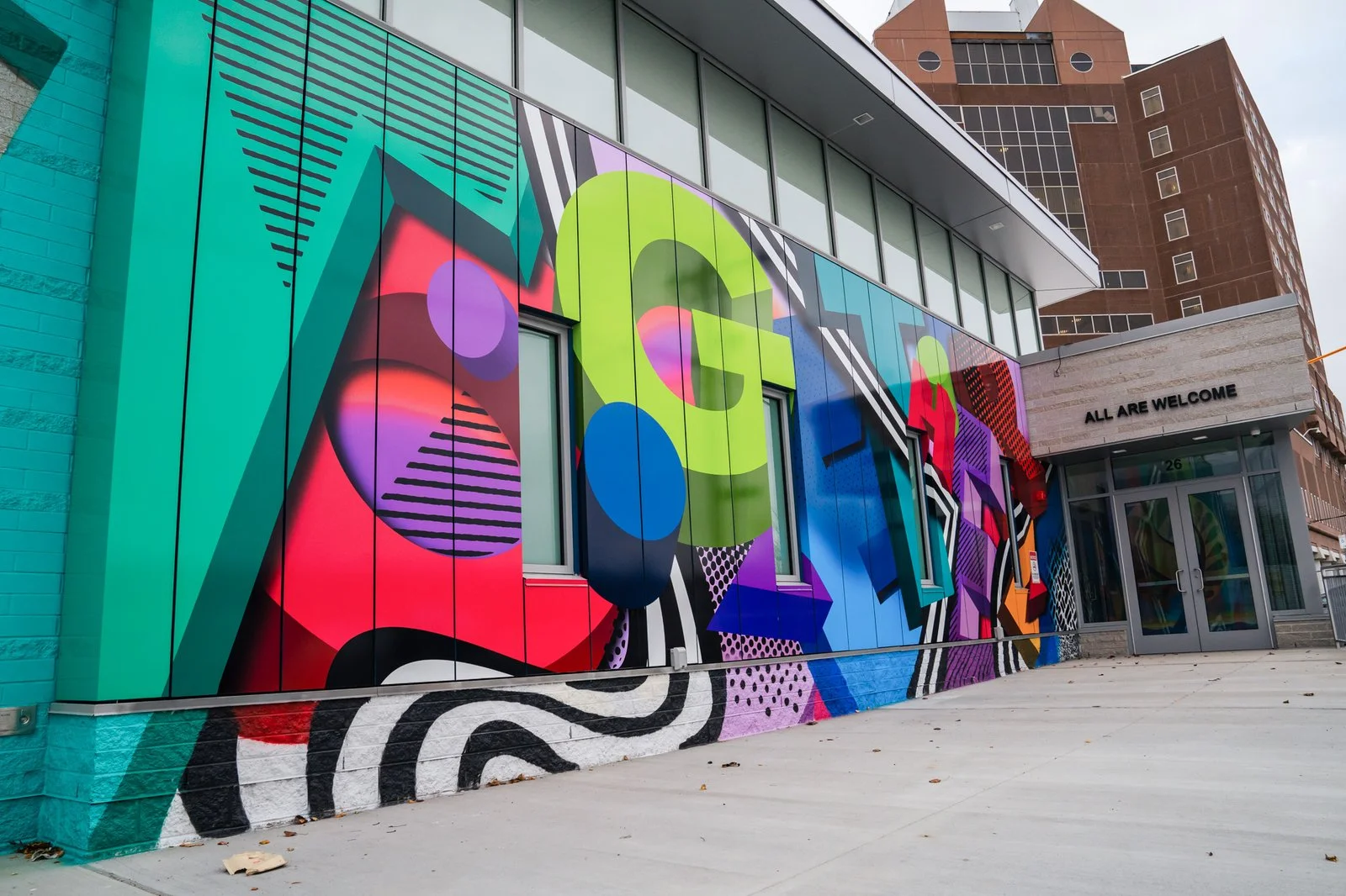 Together mural wrapping the exterior of Boston’s Engagement Center