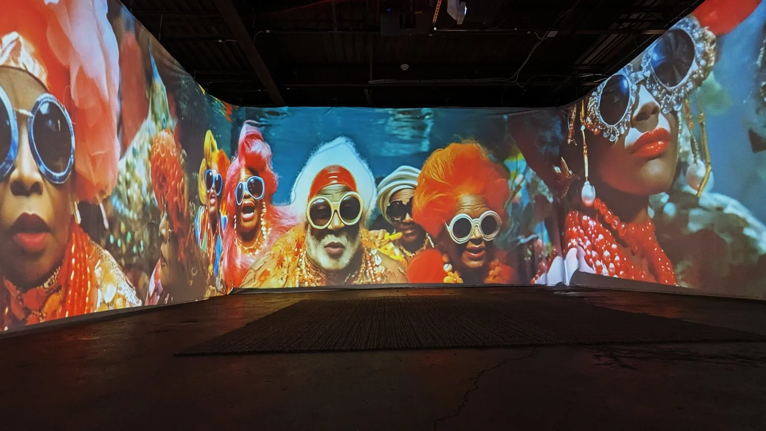 Portrait imagery projected around the ILE OMI room